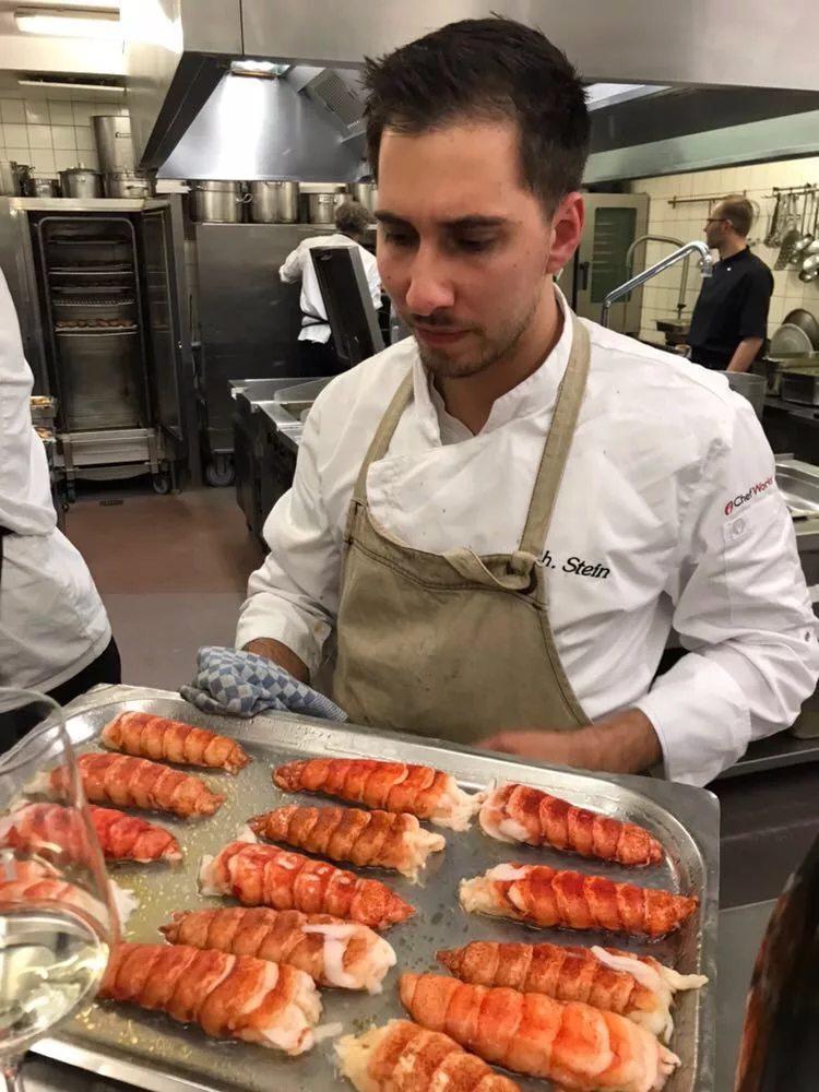 Raw high pressure processed lobsters going into the oven at a Michelin starred restaurant