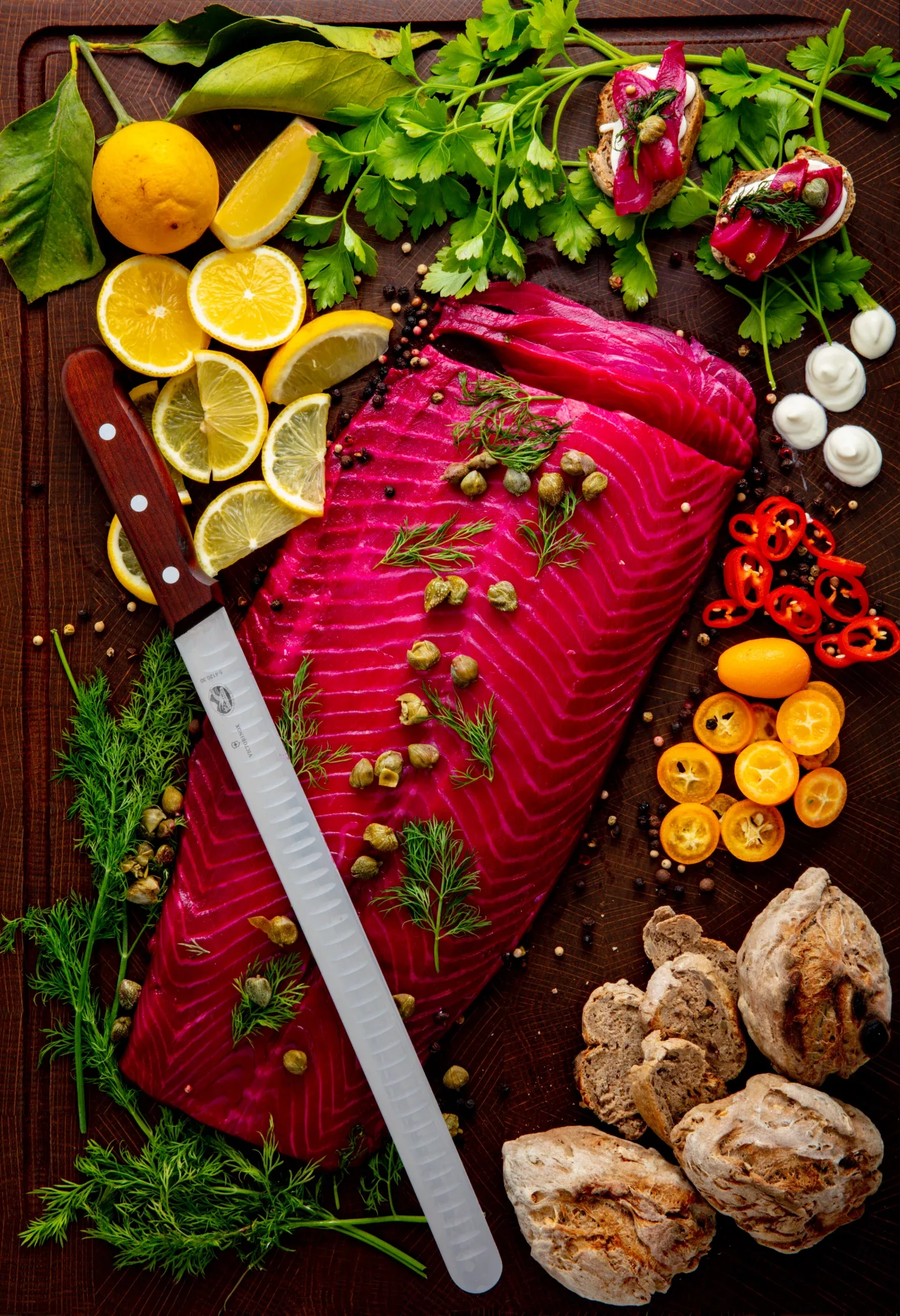 Side of dill-cured gravlax salmon with lemon and capers
